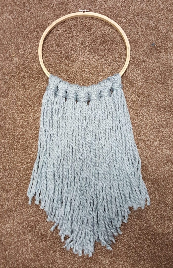 Add inner embroidery hoop to yarn art | DIY wall hanging yarn art embroidery hoop decor