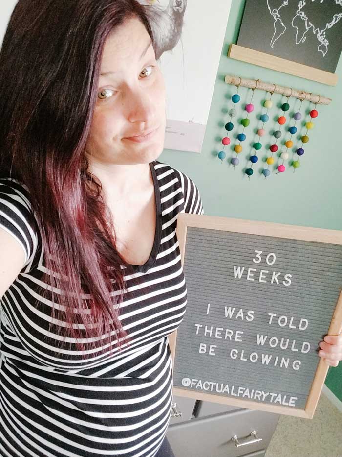 30 weeks pregnant letterboard glowing